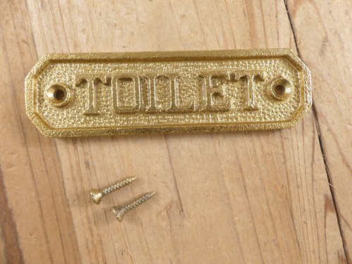 Gold metal toilet - gold, sign