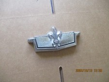 USED 1977-1990 CHEVROLET CAPRICE TRUNK LOCK FLIPPER AND BEZEL