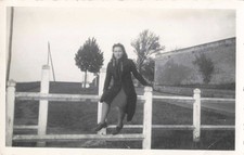 OLD PHOTOGRAPH YOUNG WOMAN POSING ON A BARRIER