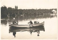 OLD PHOTOGRAPH IN A BOAT ON A LAKE CHILD ROWING MACHINE NICE VIEW