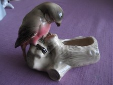 Ceramic branch parrot/parakeet.