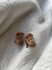 Pair of brown heeled shoes for Barbie