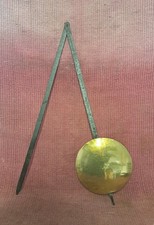 Ancien balancier d'horloge