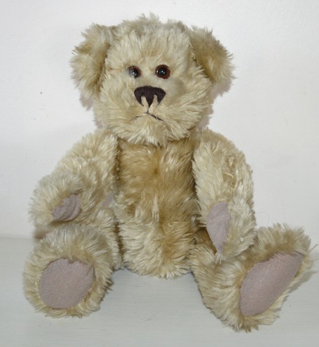Belle peluche ours articulé