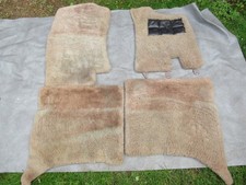 A SET OF 4 ROLLS ROYCE SHEEPSKIN OVER RUGS SILVER SHADOW by PAUL BLANCHE