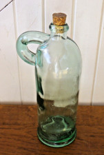 Ancienne bouteille bonbonne carafe en verre épais avec anse très haute