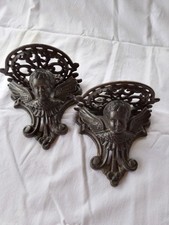 paire de consoles en fonte angelots