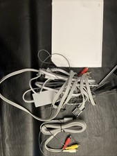 Complete Wii With Extra Sensor Bar And Cables.