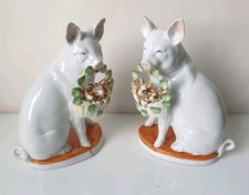 sculpture paire cochon yeux