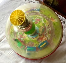 ANTIQUE 1960S SHEET METAL AND PLASTIC PANORAMIC SPINNING TOP WITH TRAIN
