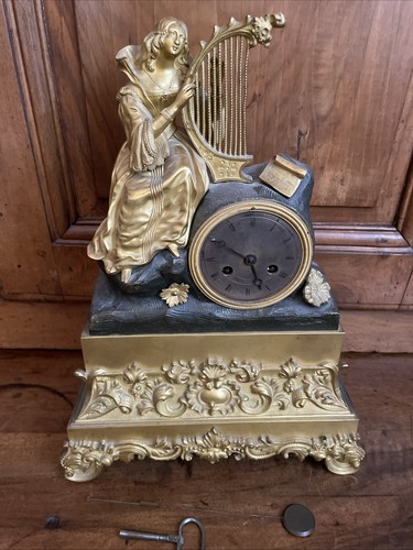 Pendule bronze mouvement - en,