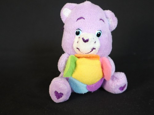 Bisounours violet avec fleur