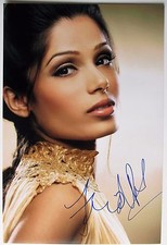 FREIDA PINTO SIGNED 8x12 PHOTO