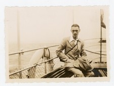 PHOTO snapshot, an elegant young man on a bench boat pontoon