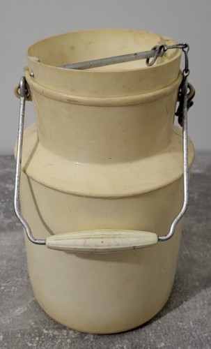 Antique yellow plastic milk