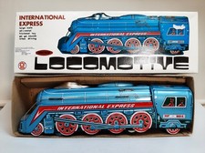 Ancien jouet LOCOMOTIVE à friction et en tôle "International Express"