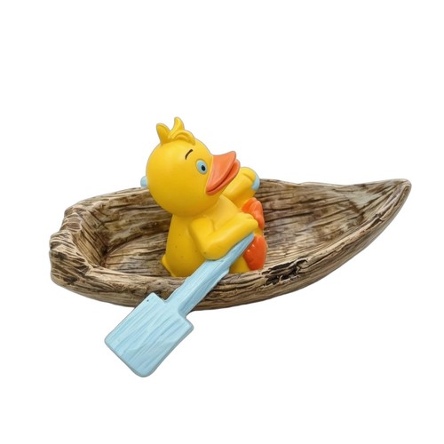 Canard dans une - , barque