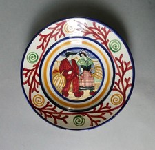 assiette en faïence signée