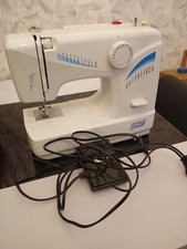 Machine à coudre QUIGG md