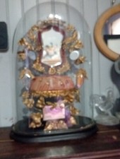 Antique pewter and velvet armchair under clobe