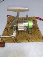 Daiwa Reel EMBLEM-X 0 with drawstring case