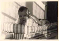 OLD PHOTOGRAPH 1957 YOUNG BABY LYING ON HIS MATTRESS