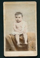 Late 19th Colorized Photo Baby with Necklace Sitting on a Blanket