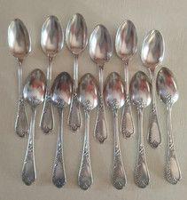 12 petites cuillères décor IRIS et 1 louche en métal argenté Art Nouvaeu