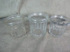 THREE GLASS JAM JARS.