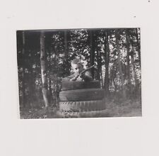 Young Boy Shooting Fairground Tires & Wood Branch Film Snapshot
