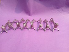 Suite de 8 portes-couteaux