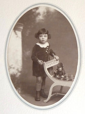 Girl side look pose plush monkey - old photo, L. Déchamps, Rouen 1931