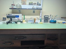 Watchmaker's table with lamp, tools and vibrograph included.