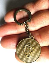 Ancien porte clé métal BG Barbara Gould Produits de Beauté Paris New York.