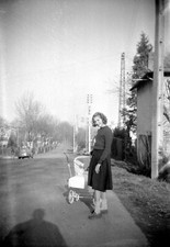 Young woman with pram stroller child - old negative photo year. 1950