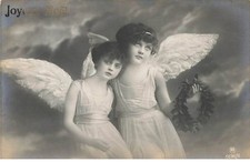 Child - Merry Christmas - Two young girls carrying each wing - Angel