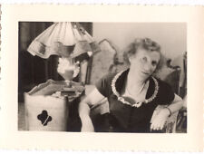 Woman sitting armchair living room - old amateur photo year. 1940 50