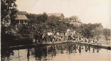 OLD PHOTOGRAPH GROUP OF YOUNG CHILDREN BY THE EDGE OF A POND