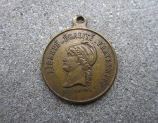 Ancienne médaille en bronze