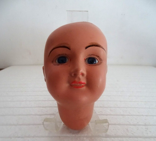 Tête poupée ancienne