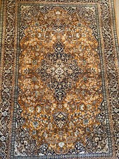 Oriental rug fine silk lush floral decor on orange background and medallion