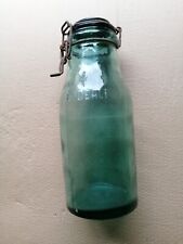 AN OLD LARGE THICK GLASS JAR