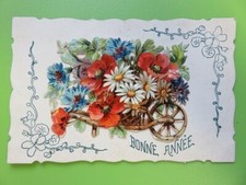 453M - postcard - Happy New Year embossed in relief - wooden wheelbarrow flowers