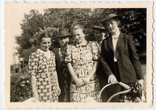 Portrait of women in front of pram - old photo year. 1950