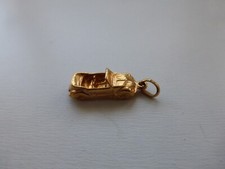 pendentif neuf plaqué or poinçon auto 2,40gr  1,7x0,7cm (dimensions sans l'annea