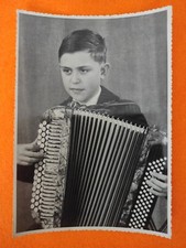 Photo child young boy playing accordion Amati IV musical instrument O-214