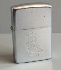 ZIPPO PETROL LIGHTER WITH TEXAS ENGRAVING AND SANTIAGS BOOTS - E X - 1994