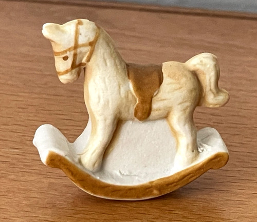 Fève mat cheval - à, bascule