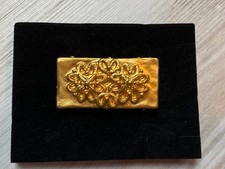 Broche dorée "Balenciaga