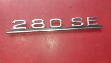 Emblem 280SE logo nameplate rear lid Mercedes W116 1168171015
